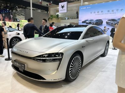 Sleek silver sedan with aerodynamic design and futuristic LED headlights