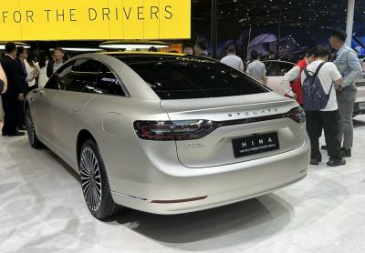 Rear view of an electric sedan with sleek taillights and aerodynamic styling