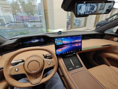 Digital dashboard and large infotainment touchscreen in luxury beige interior