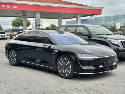 Sleek electric luxury sedan with aerodynamic shape and LED headlights.