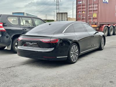 Rear view of sedan with integrated LED tail lights and tinted windows