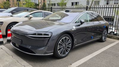 Streamlined sedan with futuristic LED headlights and stylish wheels