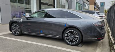 Luxury electric sedan with sleek side profile and aerodynamic design