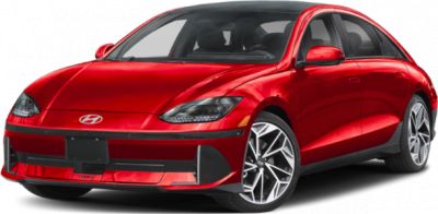 Front view of red sleek sedan with aerodynamic wheels and modern headlights