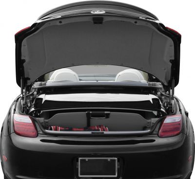Rear view of a convertible with trunk open and visible retractable roof mechanism