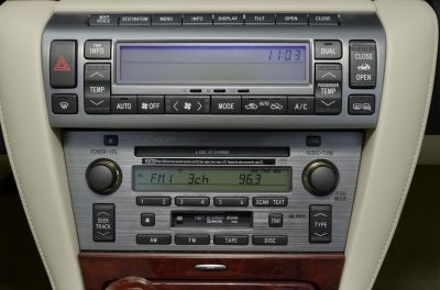 Car radio and climate control panel with CD changer and dual temperature controls
