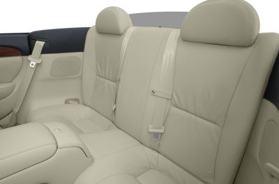 Beige leather rear seats with integrated headrests and seat belts