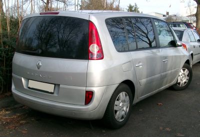 Rear and side view with tall vertical taillights and wide tinted side windows