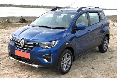 Blue SUV front angled view with grille and roof rails