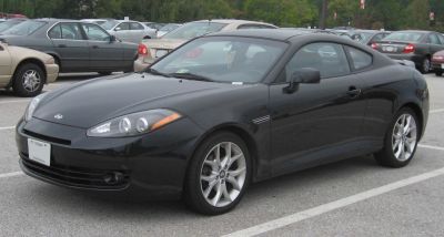 Black compact sporty coupe with sleek front and side view