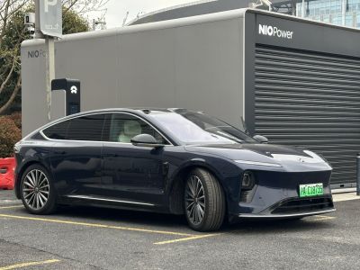 Electric sedan with panoramic glass roof and alloy wheels