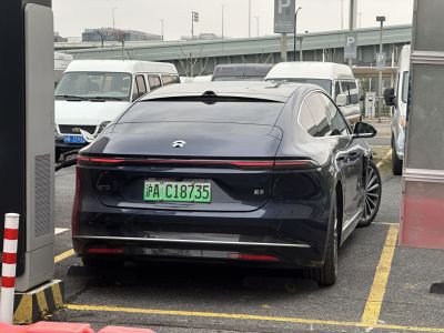 Streamlined rear view with continuous LED light bar and sporty alloy wheels.