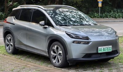 Modern electric SUV with distinctive LED headlights and smooth aerodynamic profile.