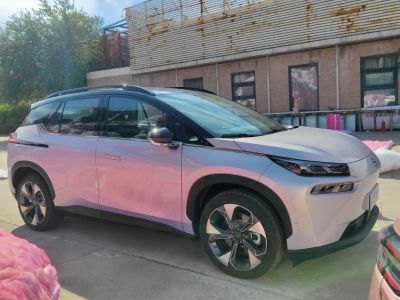 Side view of sleek electric SUV with aerodynamic body and alloy wheels