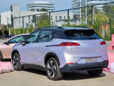Rear three-quarter view of modern electric SUV with LED tail lights and sleek design