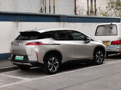Rear side profile of an electric SUV with sleek tail lights and aerodynamic styling