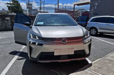 Front view of modern electric SUV with LED headlights and aerodynamic grille