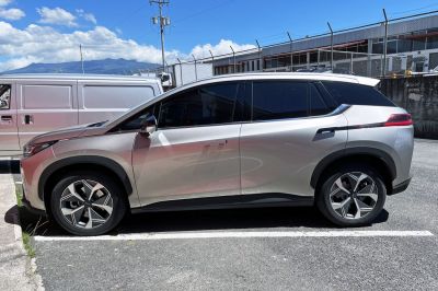 Sleek SUV side profile with modern alloy wheels and tinted windows.