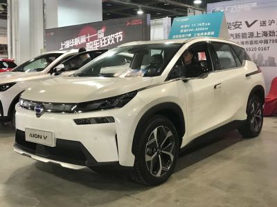Front view of electric SUV with modern headlights and alloy wheels
