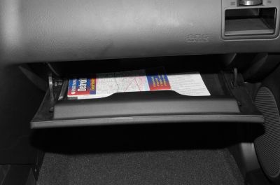 Open glove compartment with a map inside
