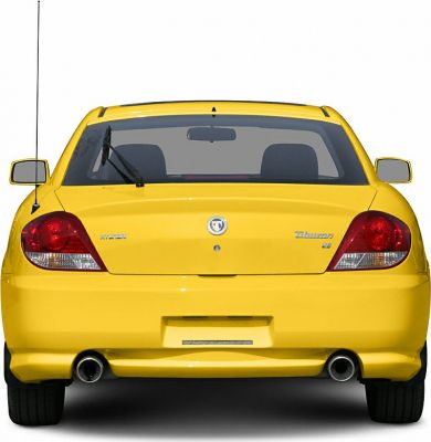 Rear view of yellow coupe with dual exhausts and distinct tail lights