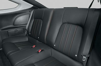 Black leather rear seats with red contrast stitching and seatbelt