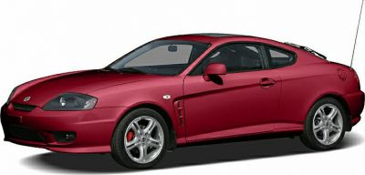 Red sports coupe with alloy wheels and sleek two-door design
