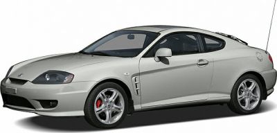 Silver sports coupe with alloy wheels and side vent design
