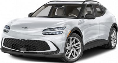Front angle view of white SUV with LED headlights and large mesh grille