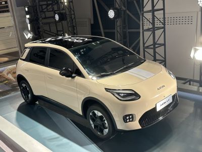 Compact electric car with unique front grille and distinct LED lighting