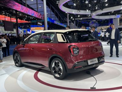 Rear and side view of electric hatchback with two-tone roof and LED tail lights.