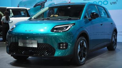 Futuristic electric vehicle with LED headlights and aerodynamic front design