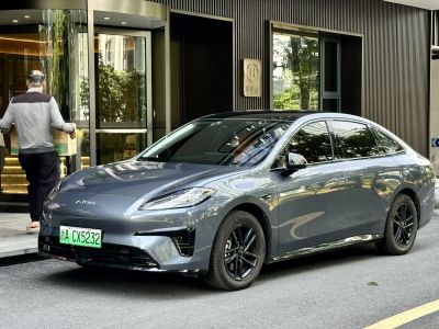 Modern sedan with slim LED headlights and black alloy wheels
