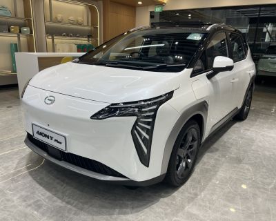 Sharp LED headlights and sleek aerodynamic white body with black roof