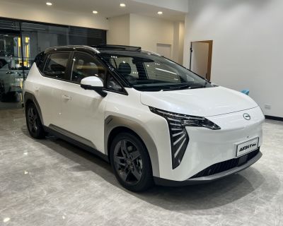 Electric SUV with futuristic vertical LED headlights and black roof