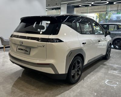 Rear and side view of modern electric SUV with LED light bar and two-tone roof