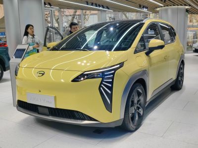 Sharp LED headlights and aerodynamic front design of a compact modern vehicle