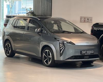 Sleek electric compact hatchback with angular LED headlights and aerodynamic shape