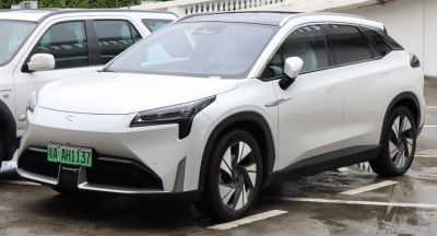 White electric SUV with LED headlights and aerodynamic design