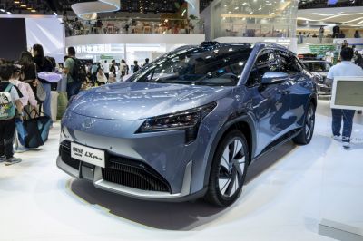 Front view and alloy wheels of an electric SUV at a car show
