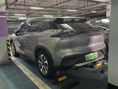 Rear-side view with roof spoiler and sleek taillights