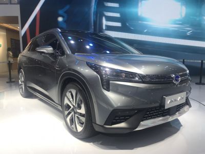 Sleek grey electric SUV front 3/4 view with alloy wheels