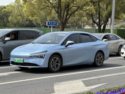 Front side view of electric sedan with sleek design and LED headlights