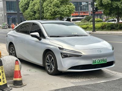 Silver electric sedan with sharp LED front lights and aerodynamic body