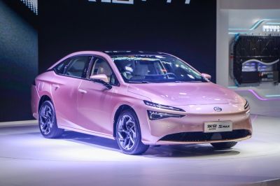 Sleek electric sedan with slim LED headlights and aerodynamic design.