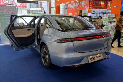 Rear view with LED light strip and open rear passenger door
