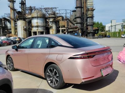 Sleek electric sedan rear with modern taillights and aerodynamic design
