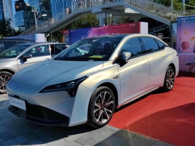 Front side view with sleek LED headlights and aerodynamic design