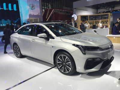 Modern sedan front and side profile with alloy wheels