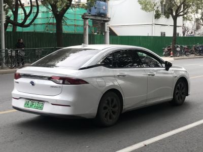 White sedan with sleek rear design and tinted windows
